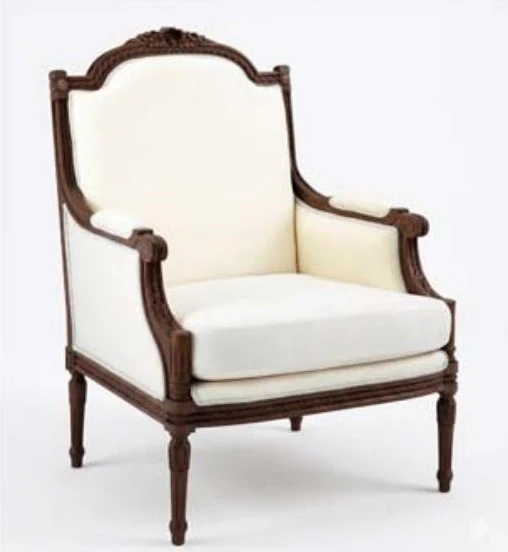 Classic armchair with a carved walnut frame and cream upholstery