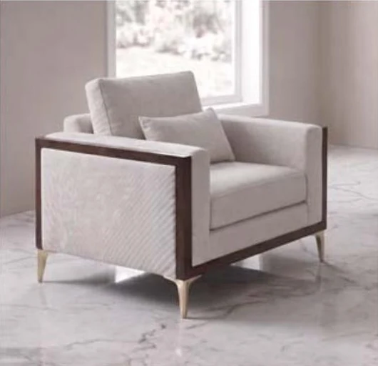 Modern armchair with a walnut frame and gold legs