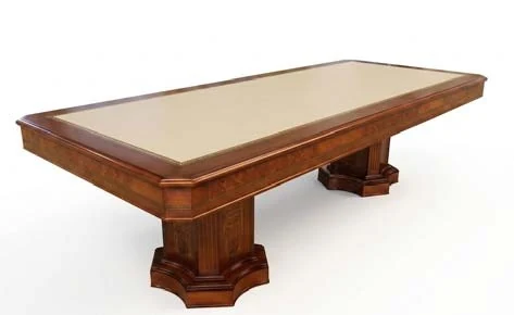 Mesa de reunión clásica con sobre de piel y bases talladas en madera noble