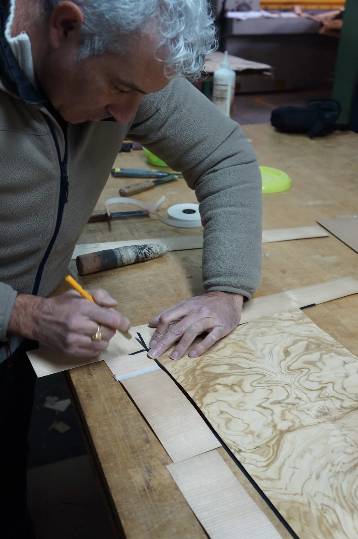 Craftsman working on a wood veneer marquetry